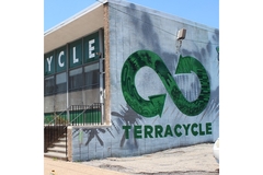 Image A building with a green and white sign from Terracycle on it.